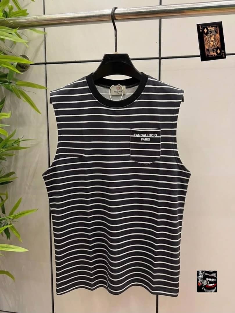 Black and white striped sleeveless top with FANDALUCIO PARIS chest pocket.