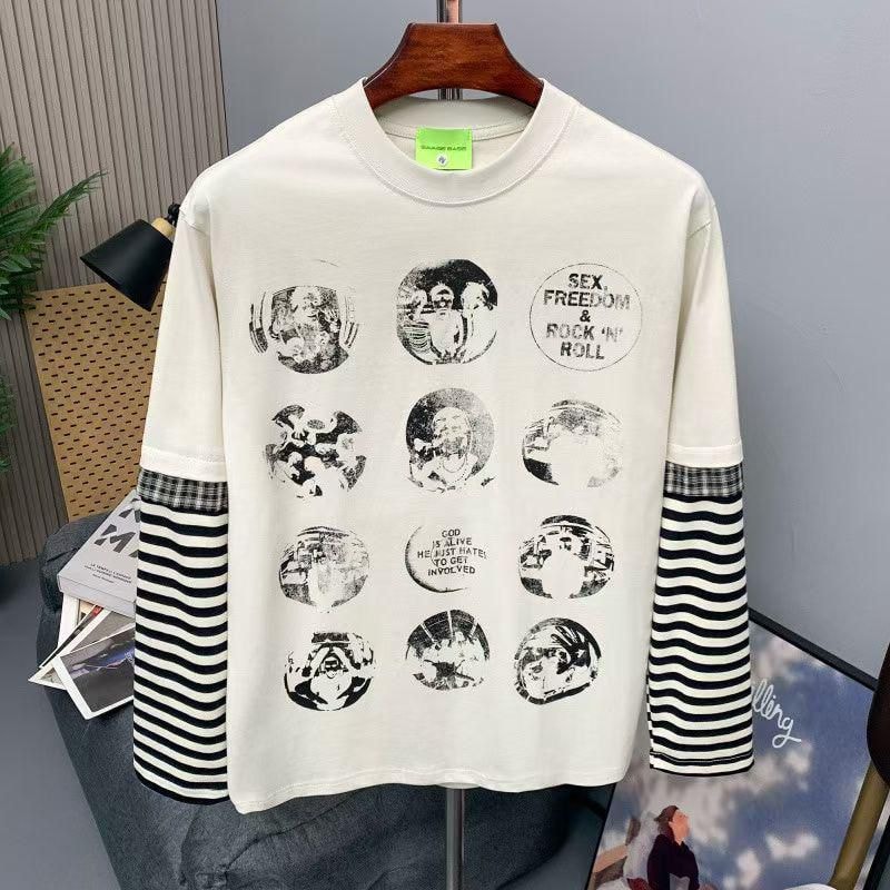 Cream long-sleeve t-shirt with multiple circular graphic prints, text details, and black-and-white striped sleeves.