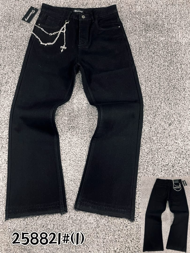 Flat lay of pure black jeans with silver chain and cross on carpet, plus small back view inset.