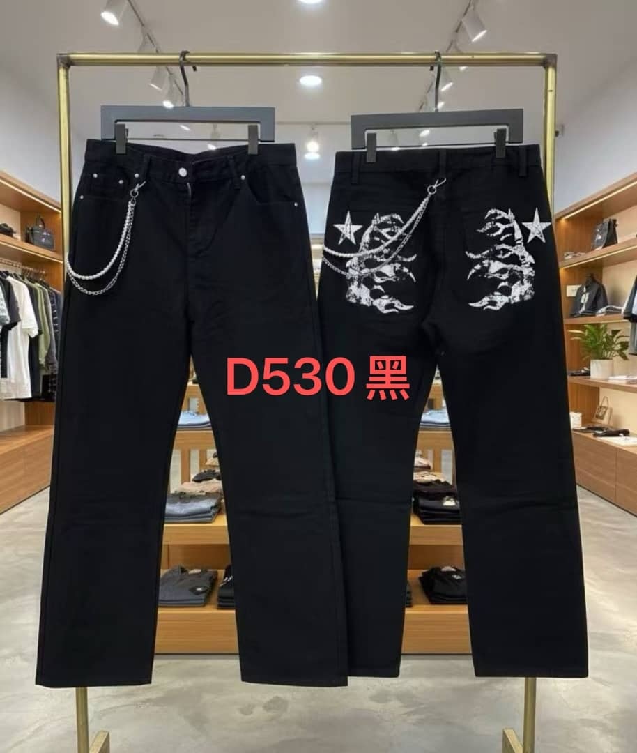 Pure black baggy jeans on display showing front chain detail and back with white graphic print.