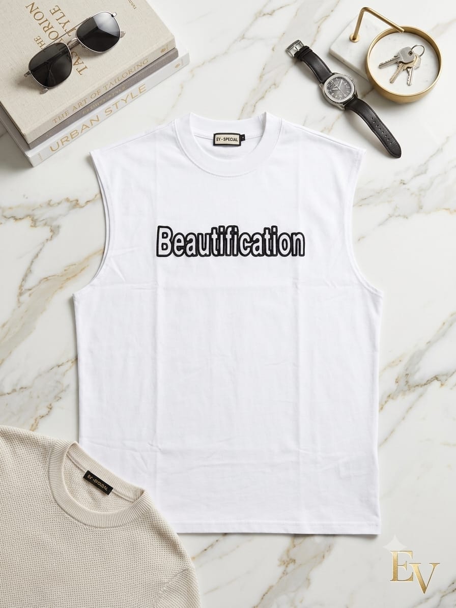White sleeveless t-shirt with Beautification text styled on marble with accessories.
