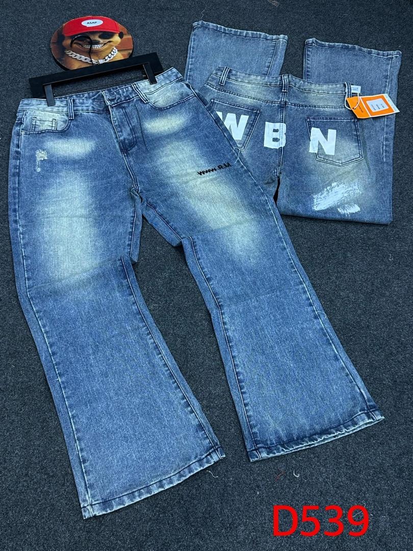 Light blue baggy jeans with WBN prints on back pockets and leg text, flat lay views with accessories.