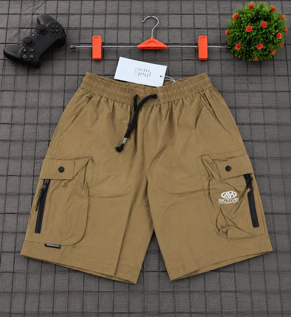 Khaki cargo shorts with Active Motorsports logo and accessories.