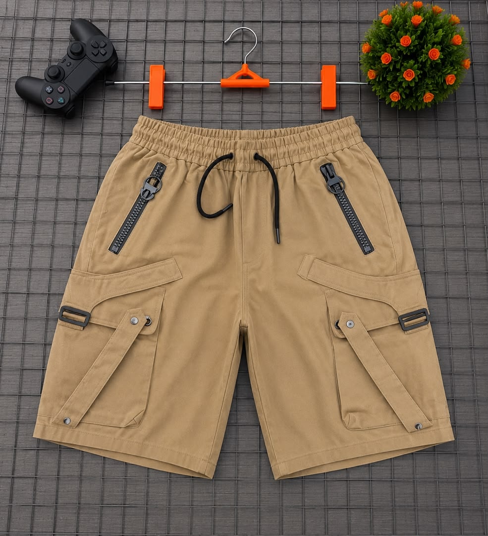 Tan khaki cargo shorts displayed on grid with hanger and accessories.