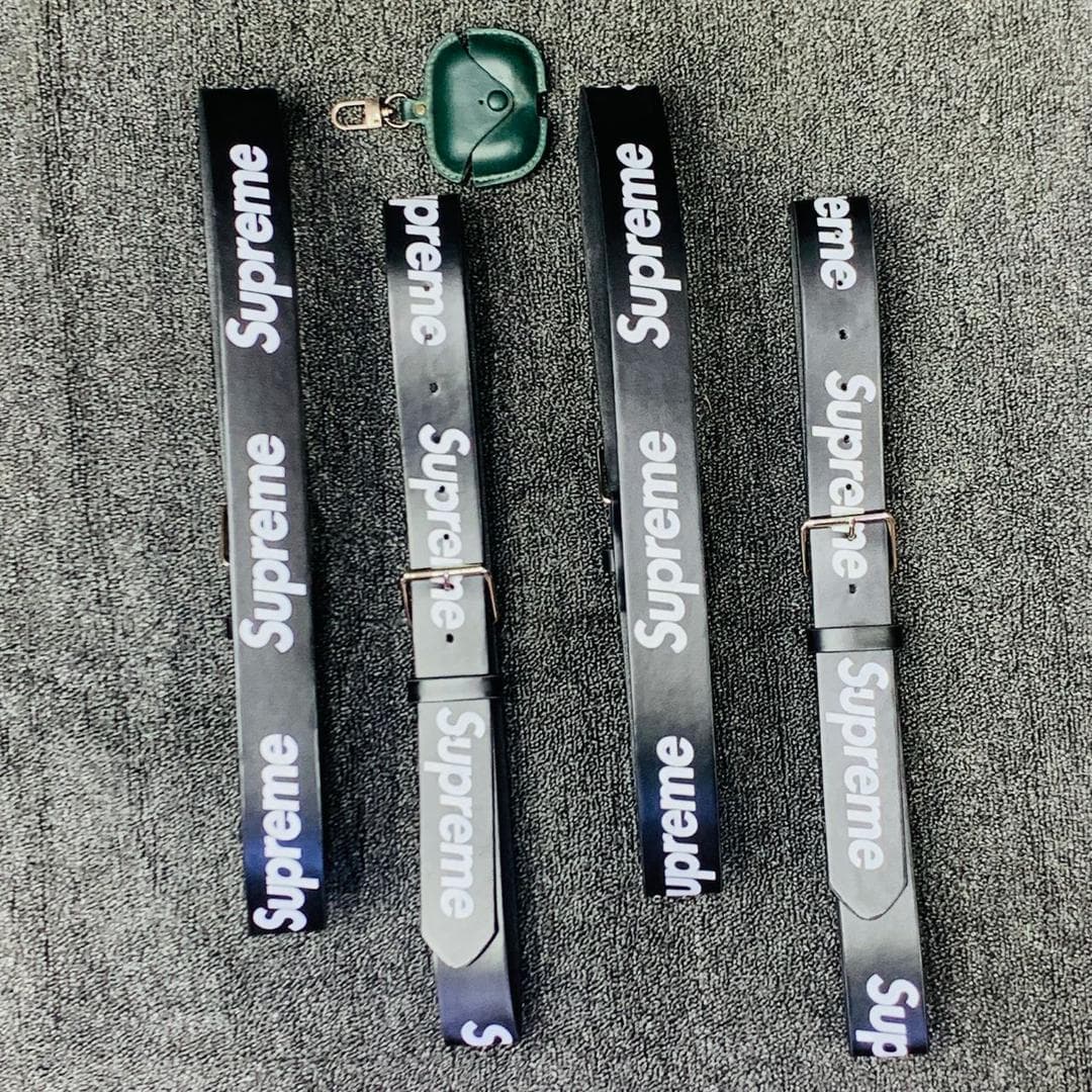 Black Supreme logo belts displayed on gray background.