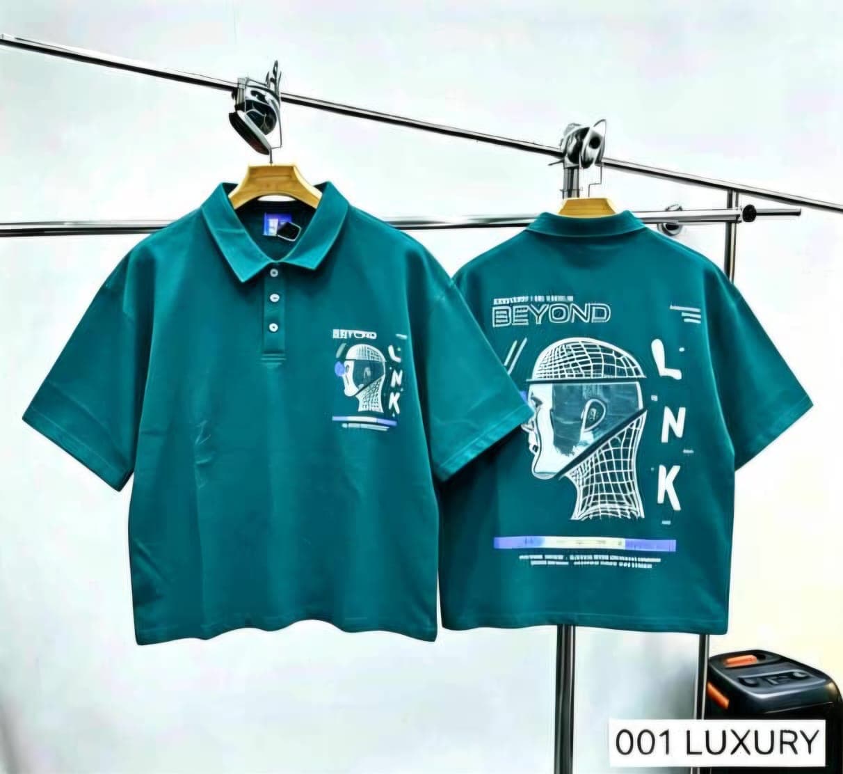 Teal polo shirt with helmet graphic, front and back views.