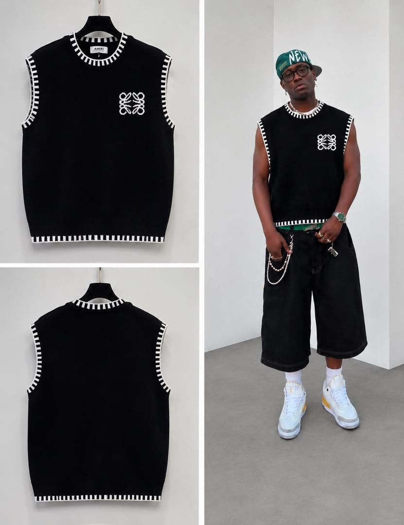 Black sleeveless knit vest with white striped trim and embroidered logo shown on hangers and model.