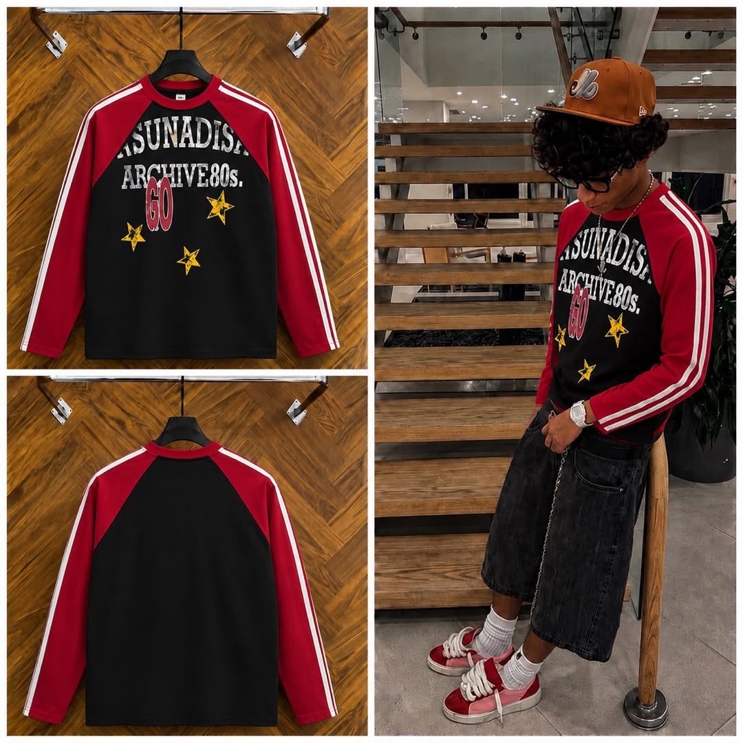 Black red raglan long sleeve tee with graphic print shown on hanger and model.