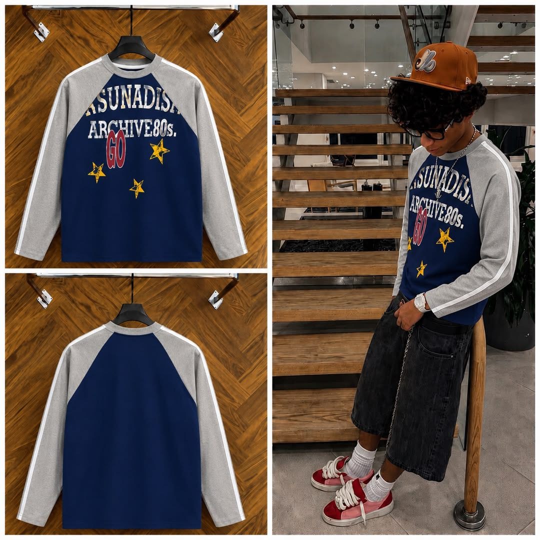 Navy gray raglan long sleeve tee with graphic print shown on hanger and model.