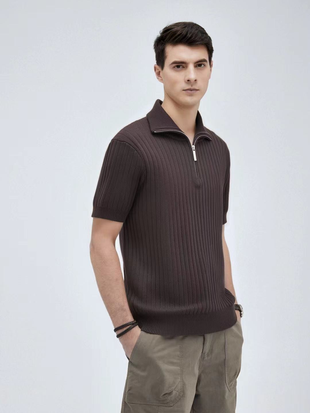 Man modeling brown ribbed knit quarter-zip polo shirt.