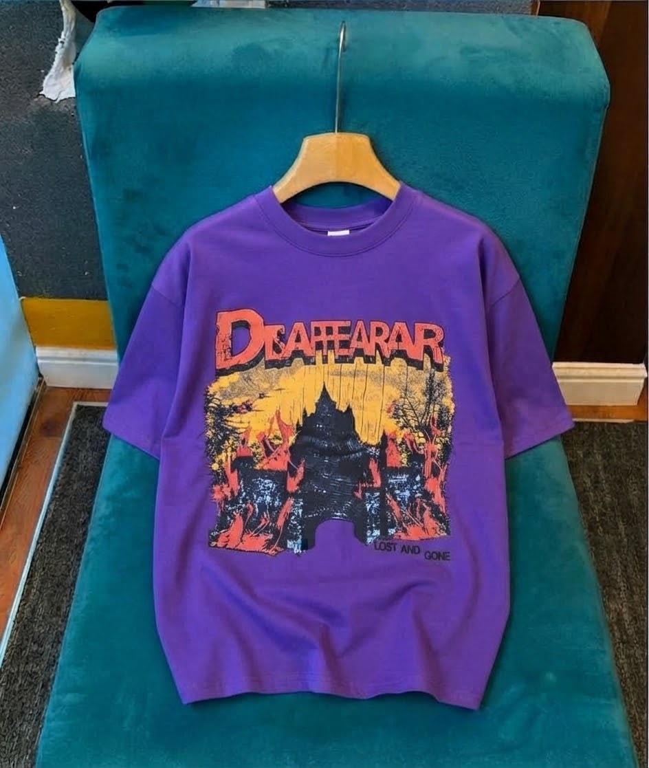 Purple short sleeve t-shirt with Disappear castle graphic.