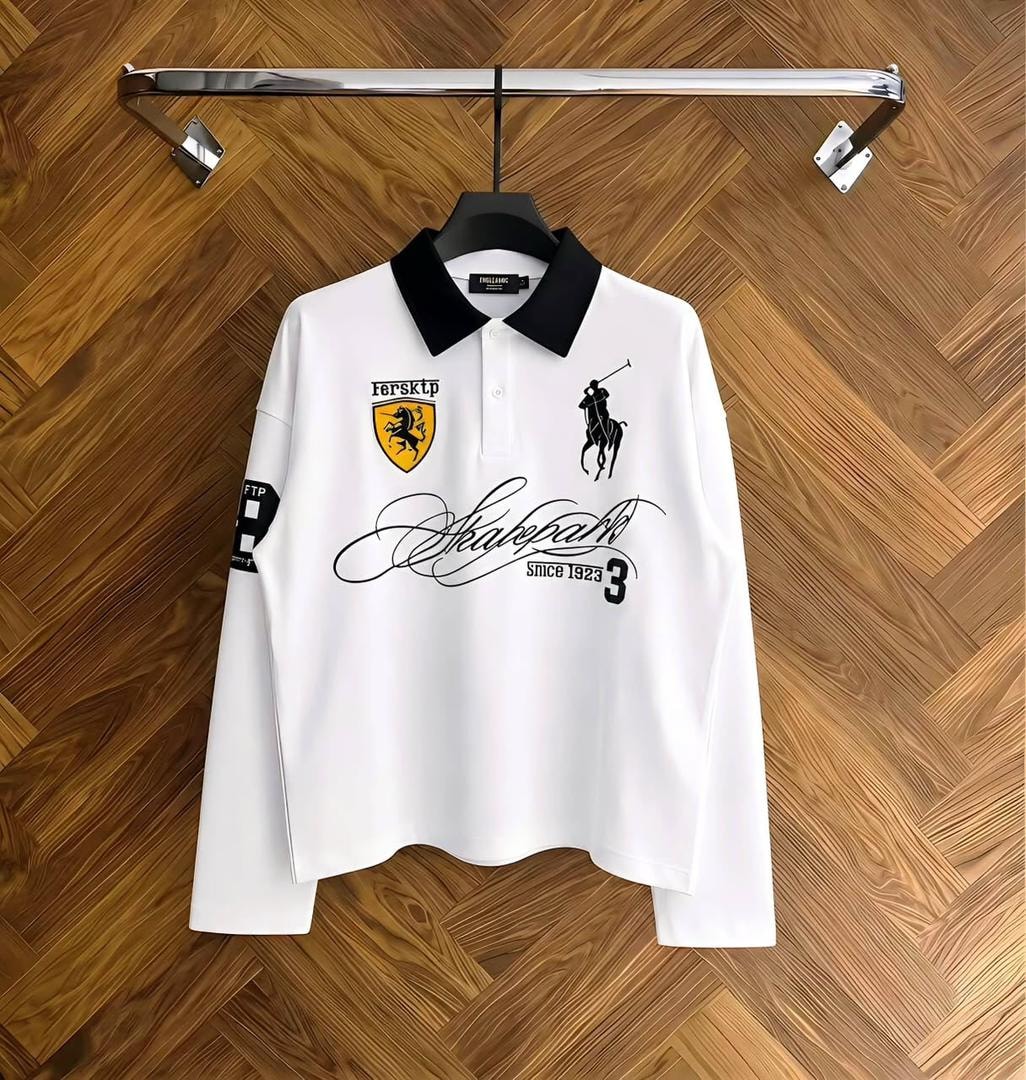 Black long sleeve polo shirt with white collar and white graphic prints on chest and sleeve.