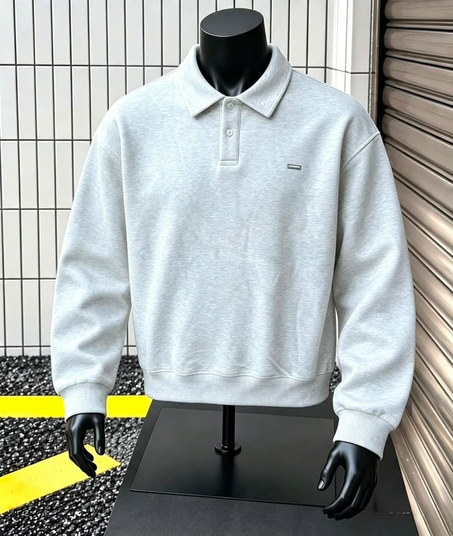 Gray long sleeve polo sweatshirt on black mannequin.