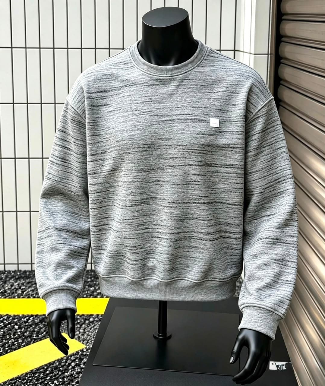 Light gray marled sweatshirt on mannequin.