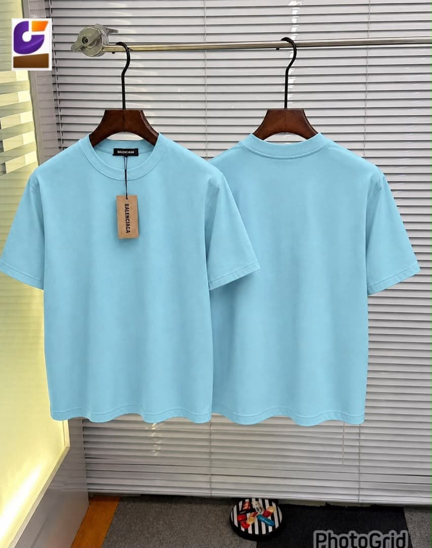 Light blue plain t-shirt shown from front and back on hangers.