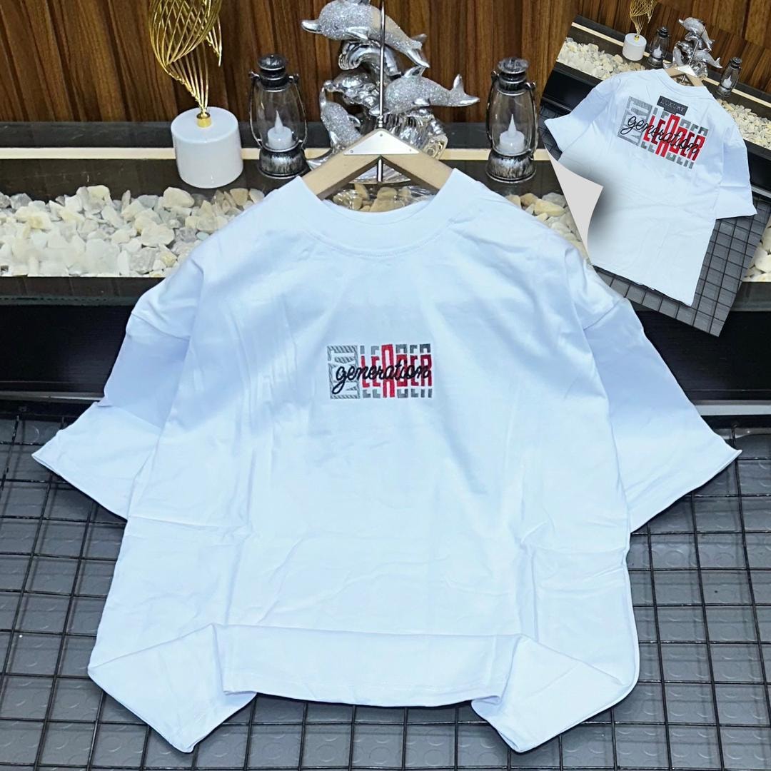 White oversized polo with Generation Leader graphic print on chest and back inset.