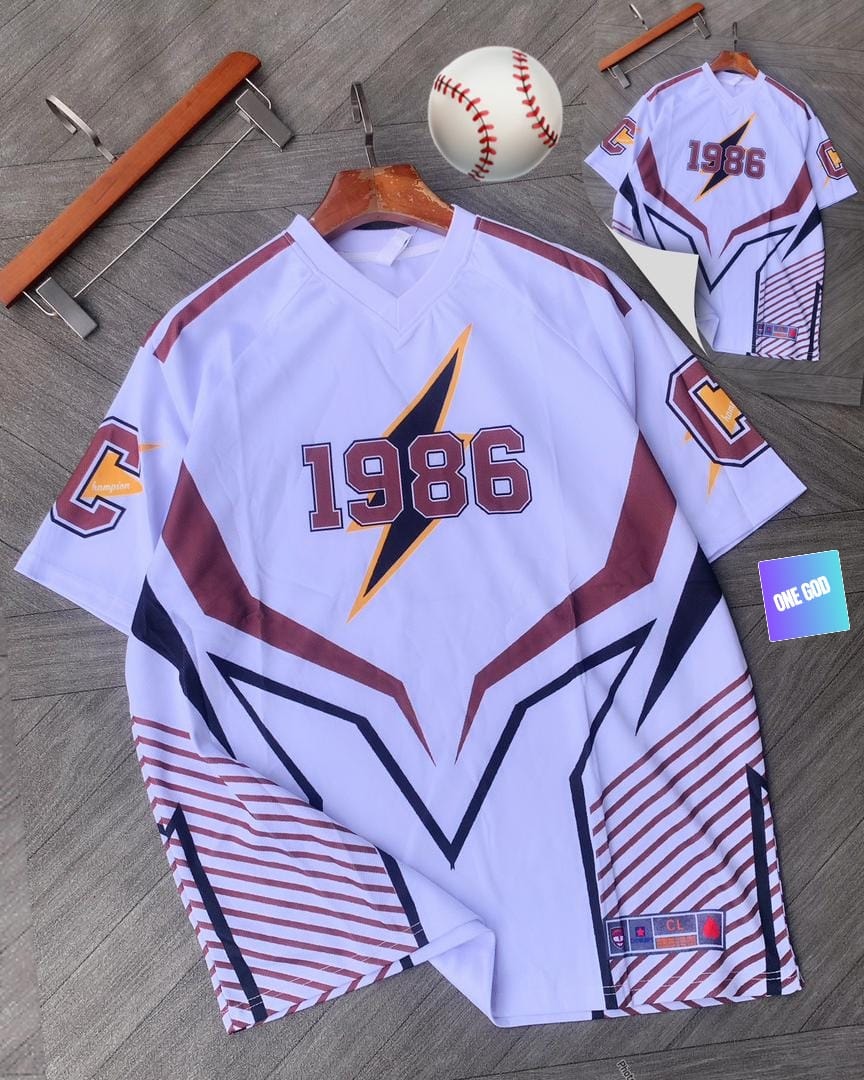 White baseball jersey with 1986 lightning bolt graphic, baseball and back view inset.