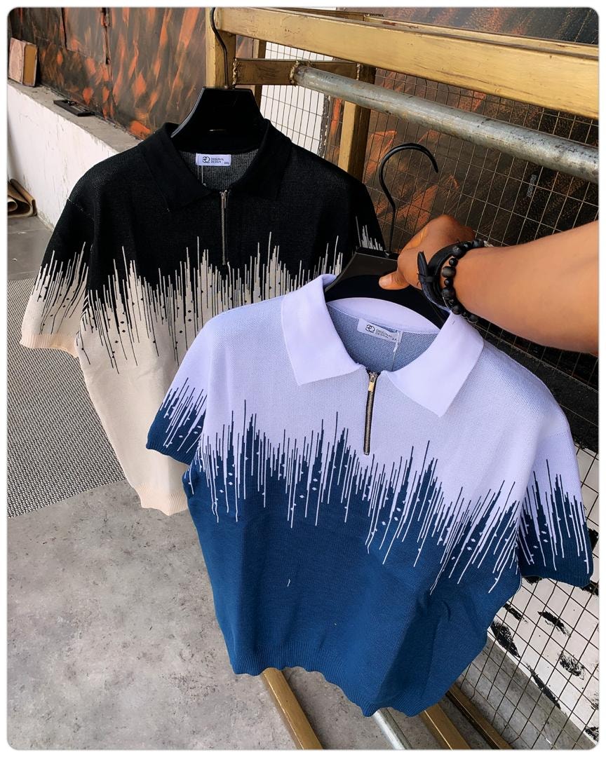 Blue-white drip knit polo held in front with black-cream drip polo in background.