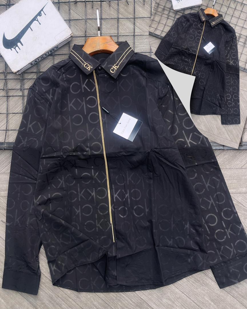 Black CK monogram luxury shirt with all-over print, CK collar detail and tag.