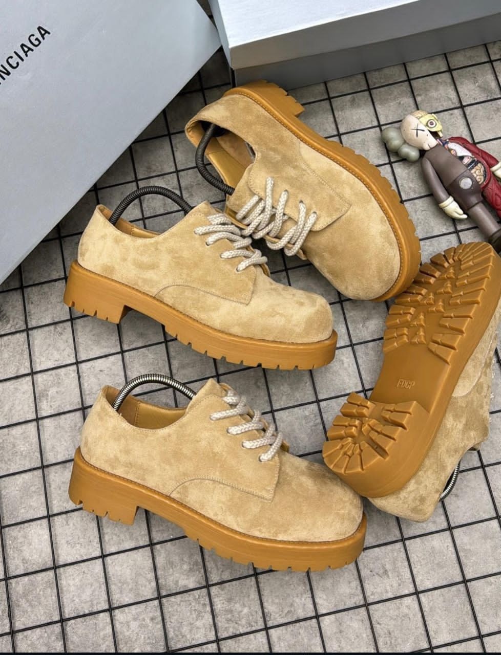 Tan suede platform lace-up shoes shown in multiple angles on tiled floor including top, side and sole views.