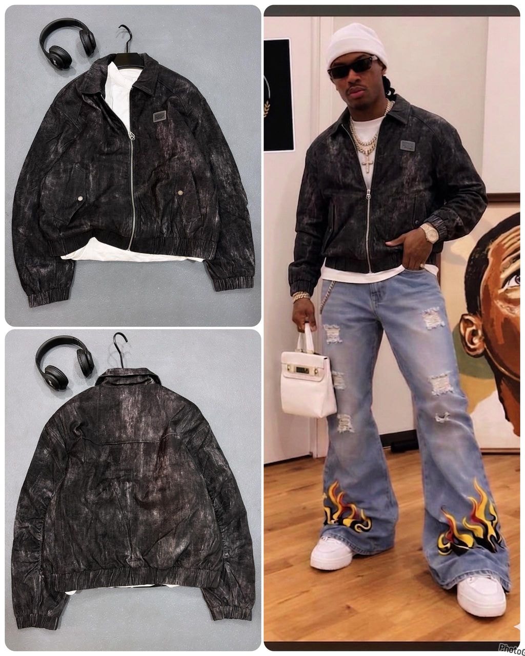 Black Omega distressed bomber jacket shown in flat lay and on model with jeans and accessories.