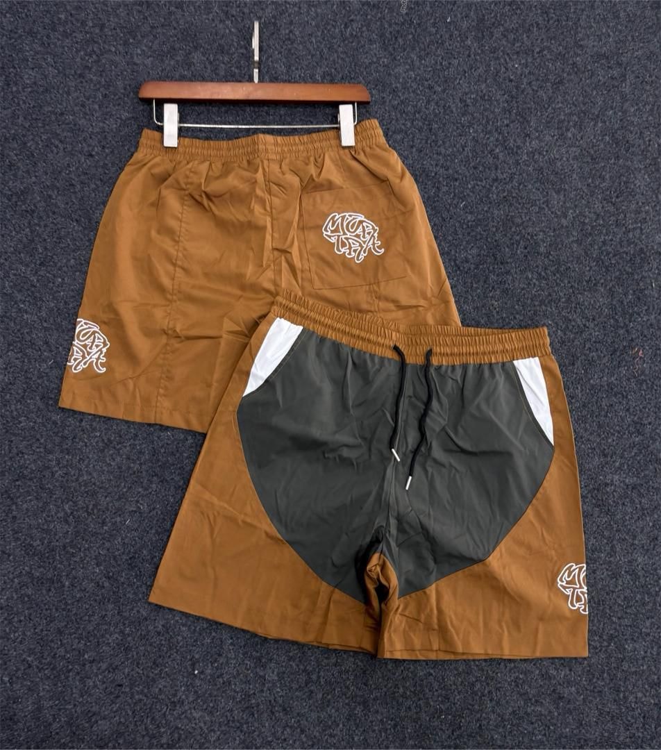 Brown graffiti logo shorts with dark gray heart panel.