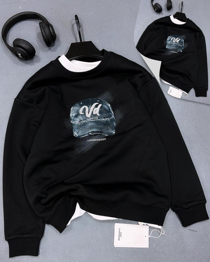Black crewneck sweatshirt with distressed baseball cap graphic on chest.