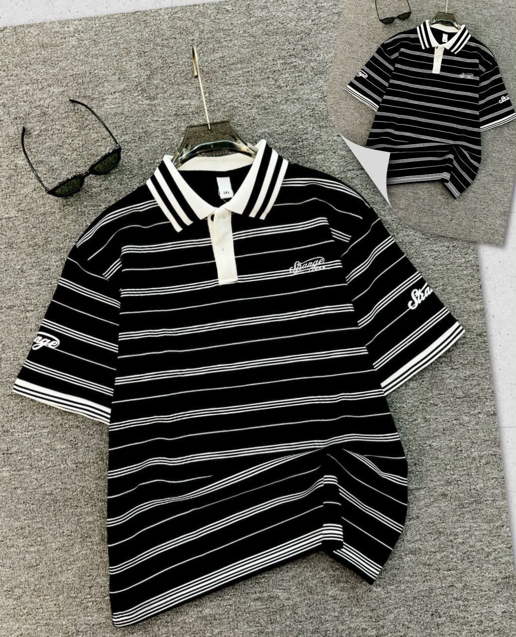 Black striped polo shirt with white horizontal stripes, contrast collar and embroidered details.