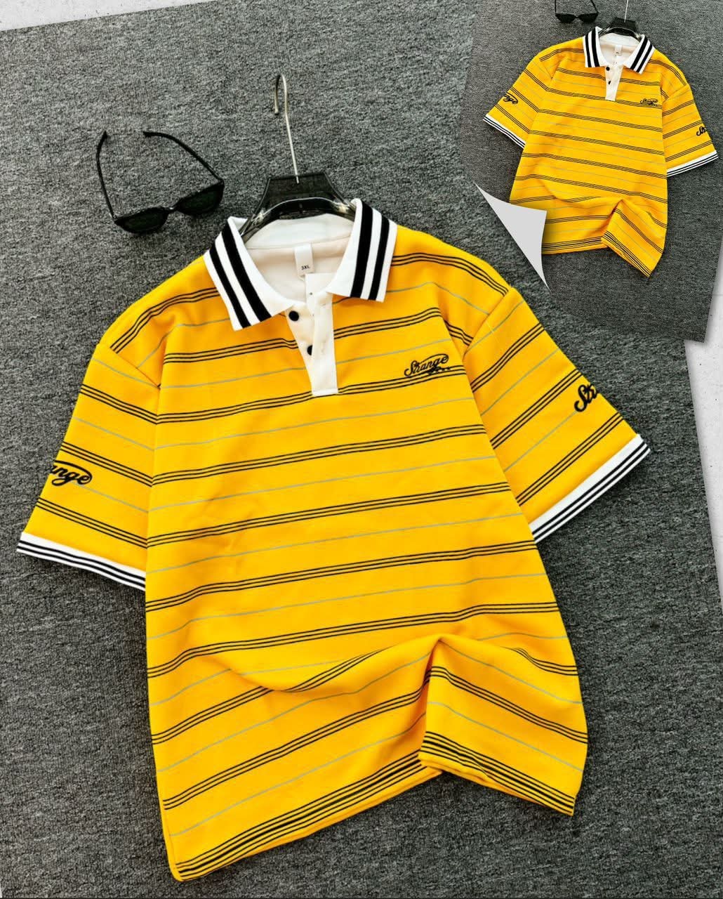 Yellow striped polo shirt with black horizontal stripes, contrast collar and embroidered details.