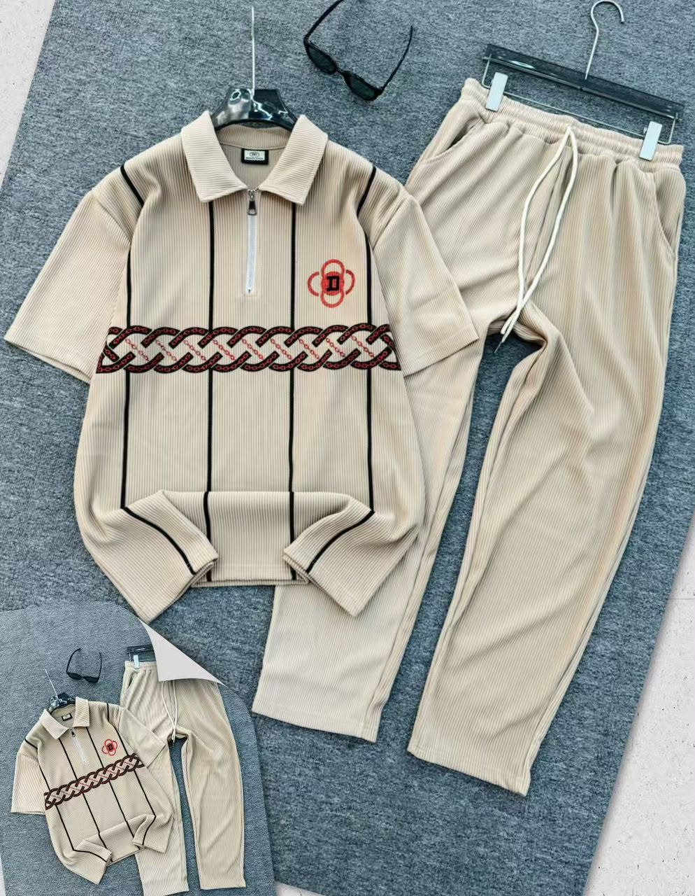 Beige ribbed polo and jogger two-piece set with chain embroidery.