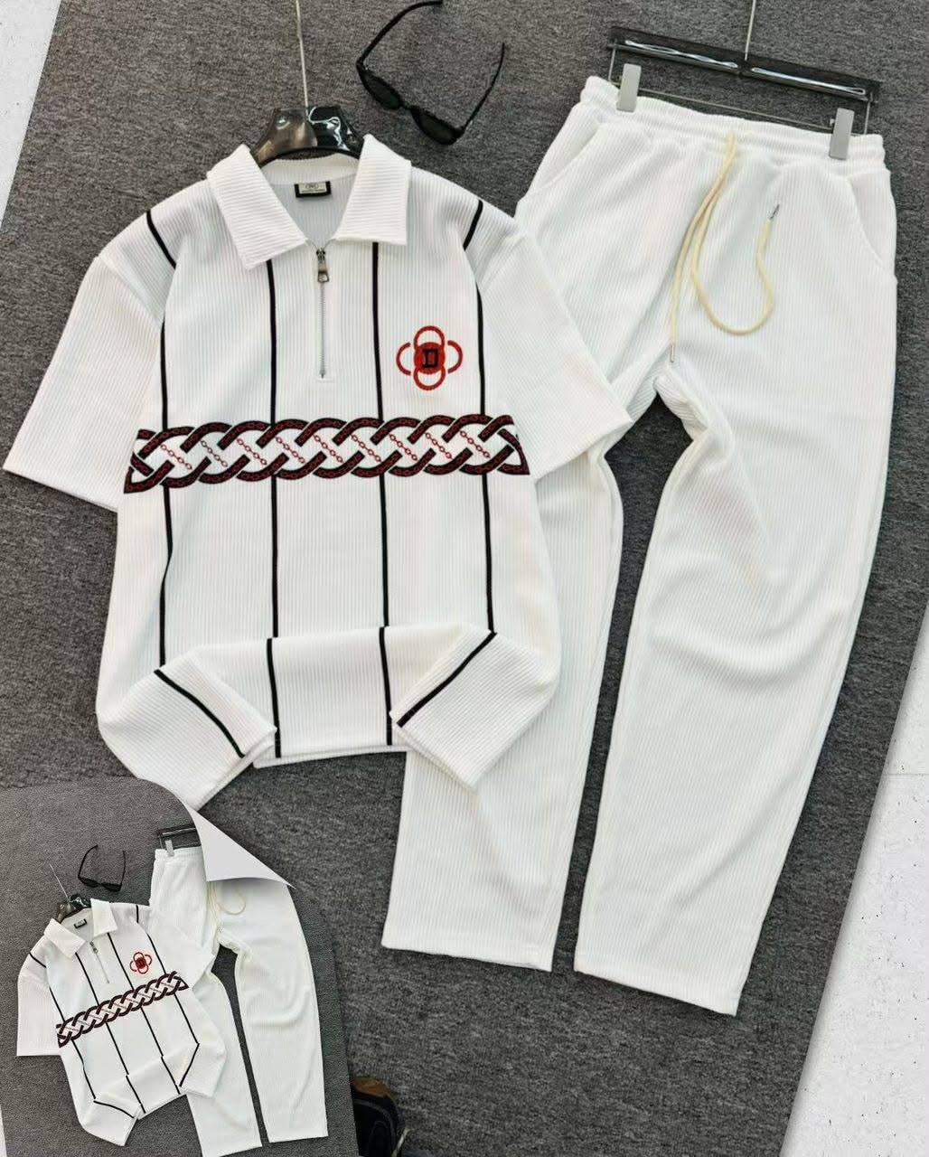 White ribbed polo and jogger two-piece set with chain embroidery.