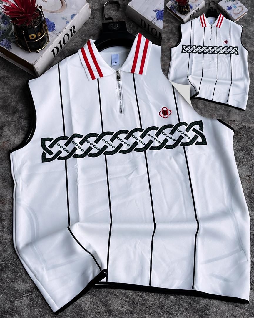 White armless top featuring dark chain pattern embroidery across chest.