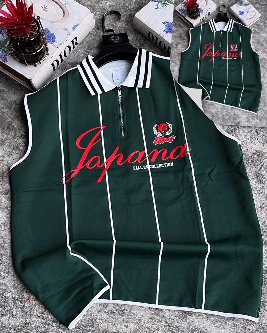 Green striped armless top with quarter zip, vertical stripes and chest graphic.