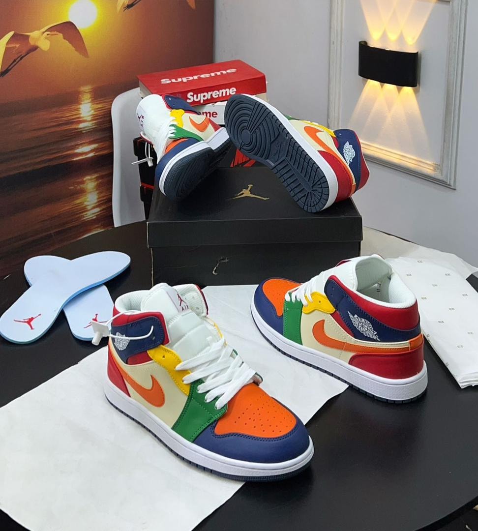 Multicolor Jordan 1 high sneakers displayed with box and insoles.