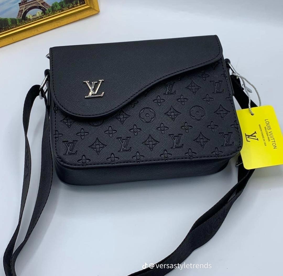 Black LV monogram crossbody bag with flap closure and yellow brand tag.