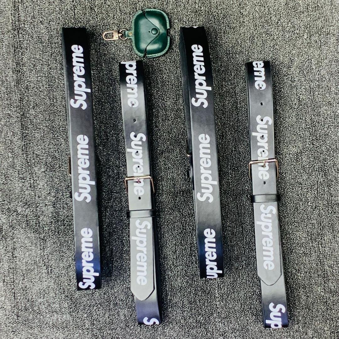 Black Supreme logo belts displayed on gray background.