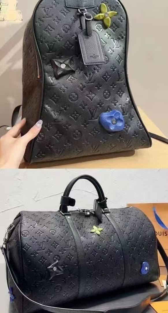 Black embossed LV backpack with flower charms and matching duffle bag.