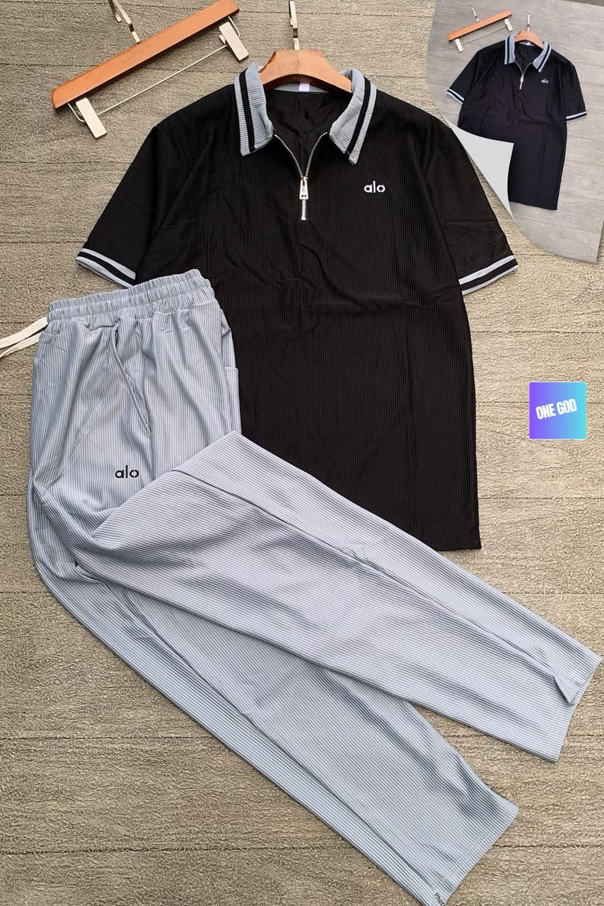 Black polo top with gray ribbed pants Alo two-piece set.
