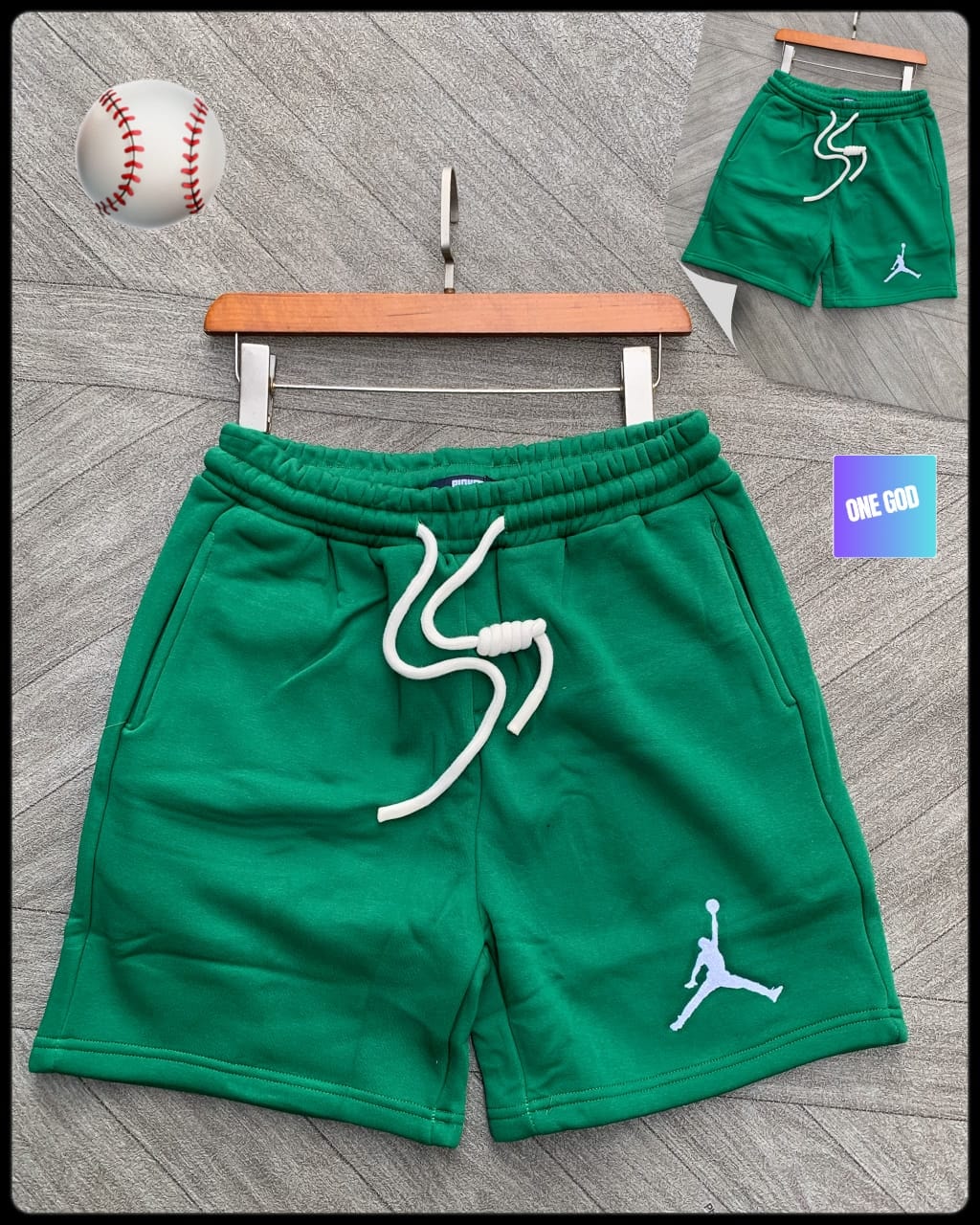 Green fleece shorts with white Jumpman logo on the leg.