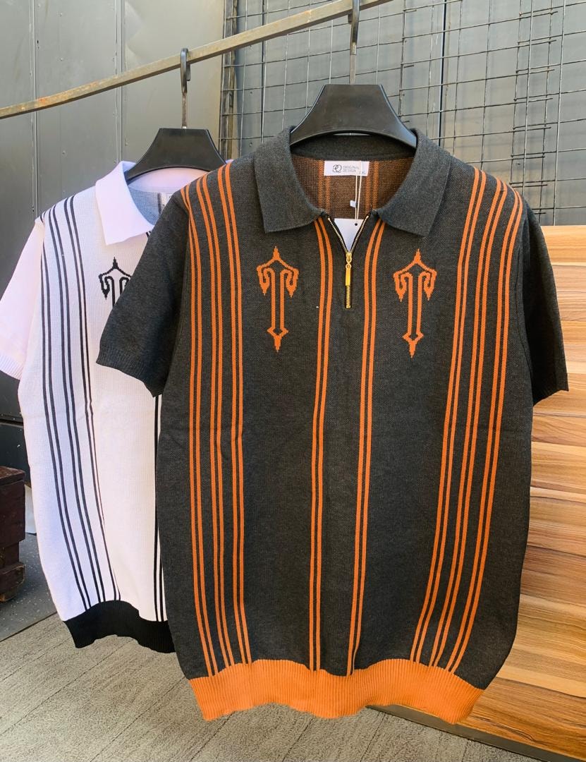 Gray knit polo with orange vertical stripes and embroidery shown alongside white and black striped version.