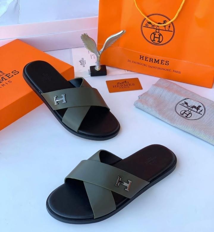 Hermes olive green slide sandals with H emblem and full luxury Hermes packaging.