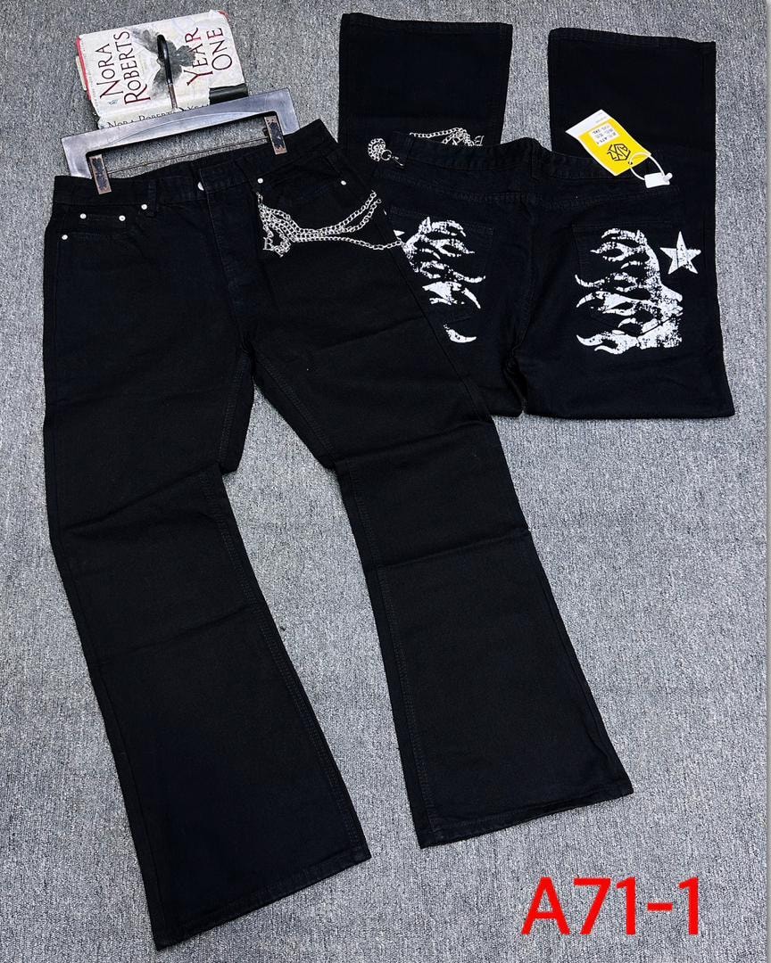 Black baggy jeans with silver chain detail and white graphic prints on back pockets, shown in flat lay and folded views.
