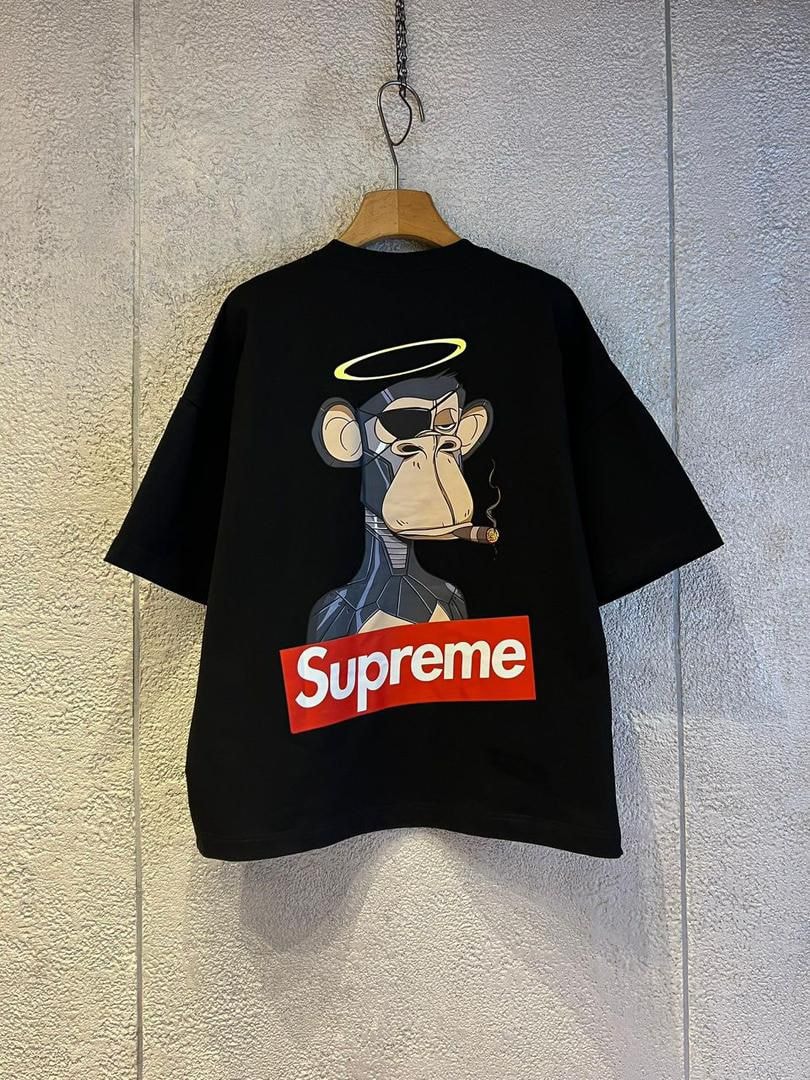 Black Supreme robot monkey graphic crop top showing back view on hanger.