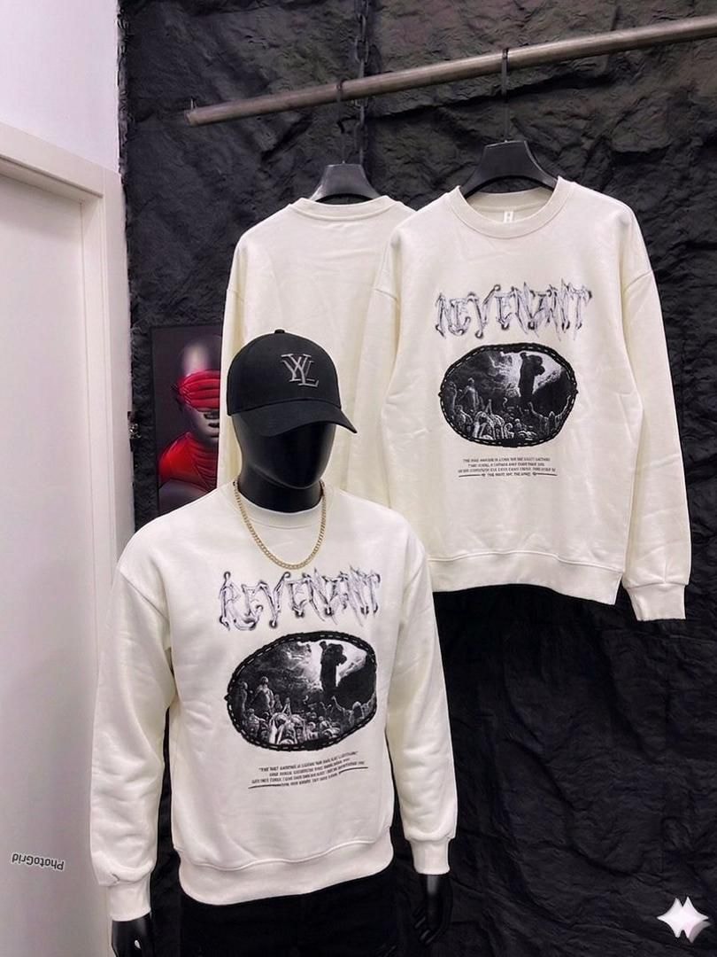 Cream Revenant graphic sweatshirt on mannequin and hanger.