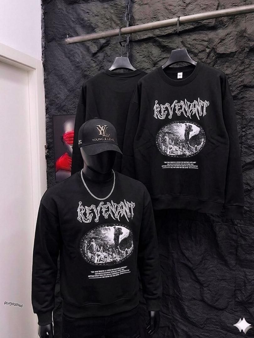 Black Revenant graphic sweatshirt on mannequin and hanger.