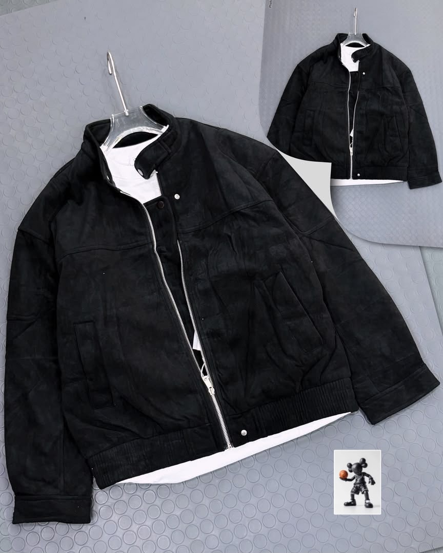 Black suede bomber jacket on clear hanger over white tee with inset back view.