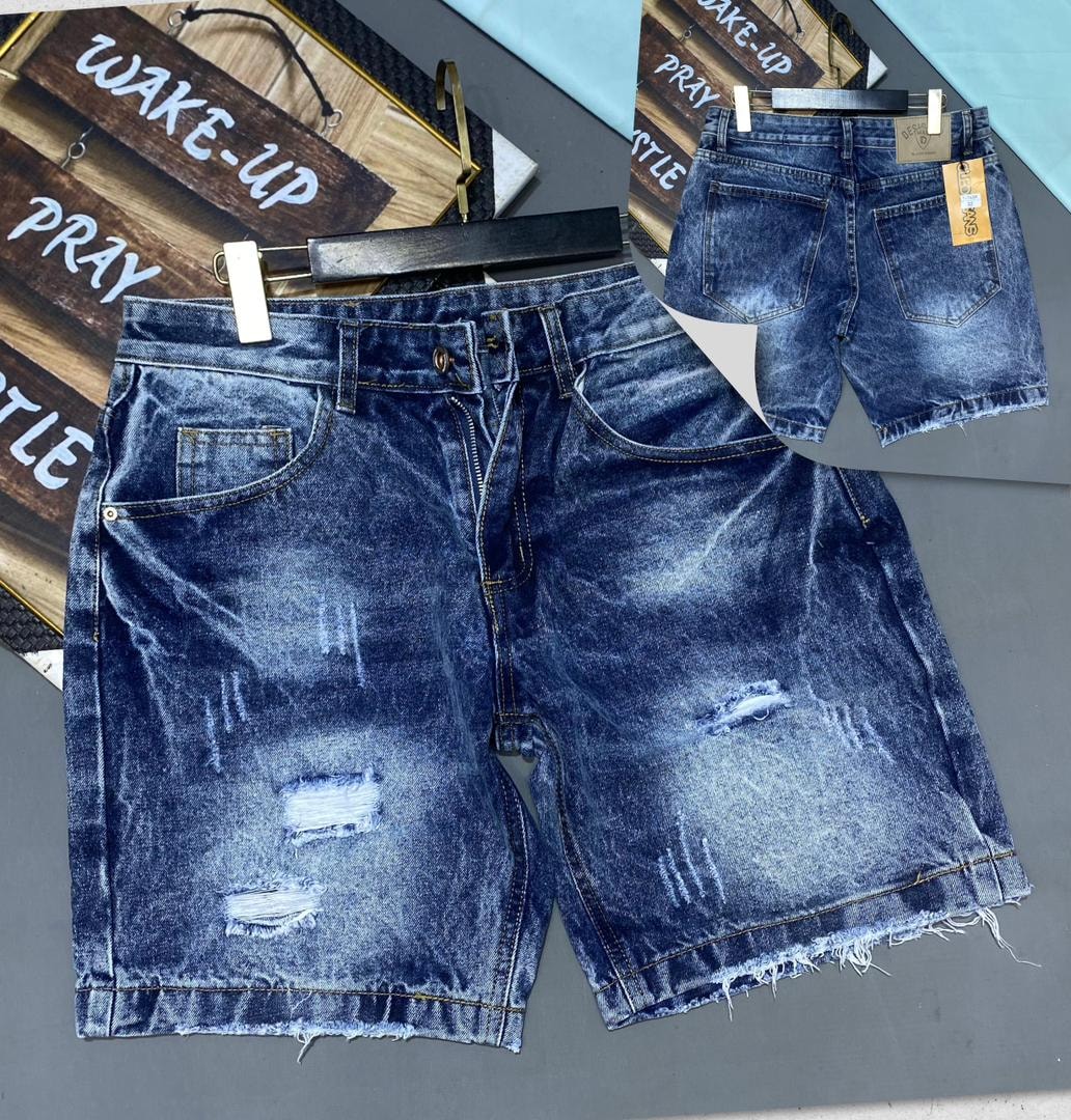 Light blue heavily distressed denim jorts with rips and raw edges, front and back views.