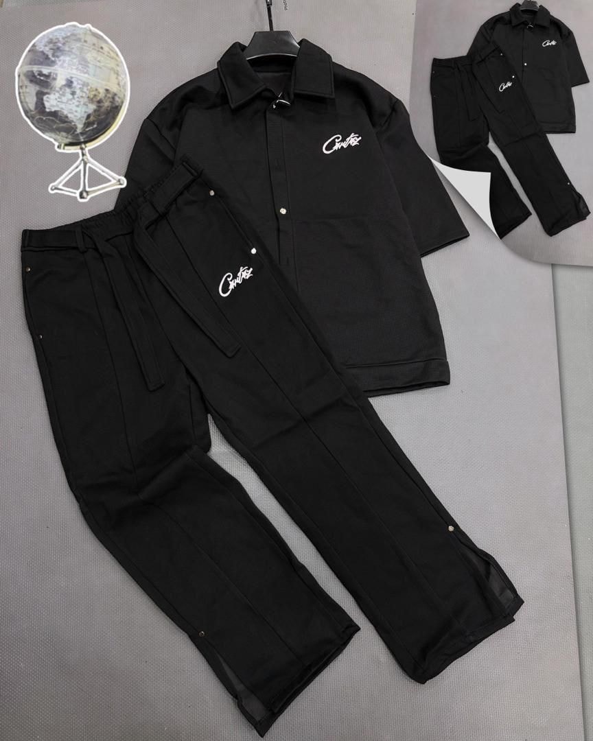 Black Cortex unisex two-piece set with button-up long sleeve shirt and drawstring pants, both featuring white Cortex logo.