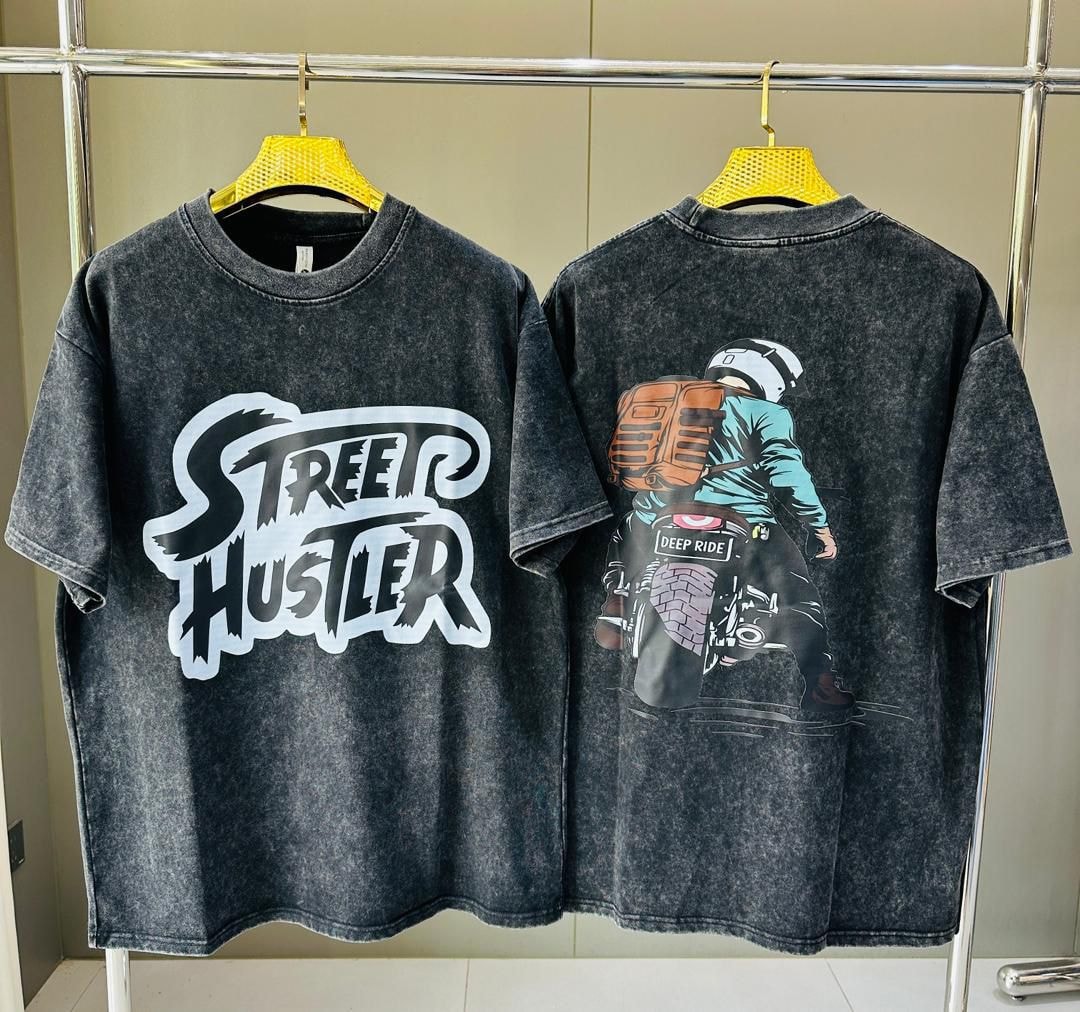 Stone wash t-shirt with STREET HUSTLER text on front and motorcycle rider deep ride graphic on back.