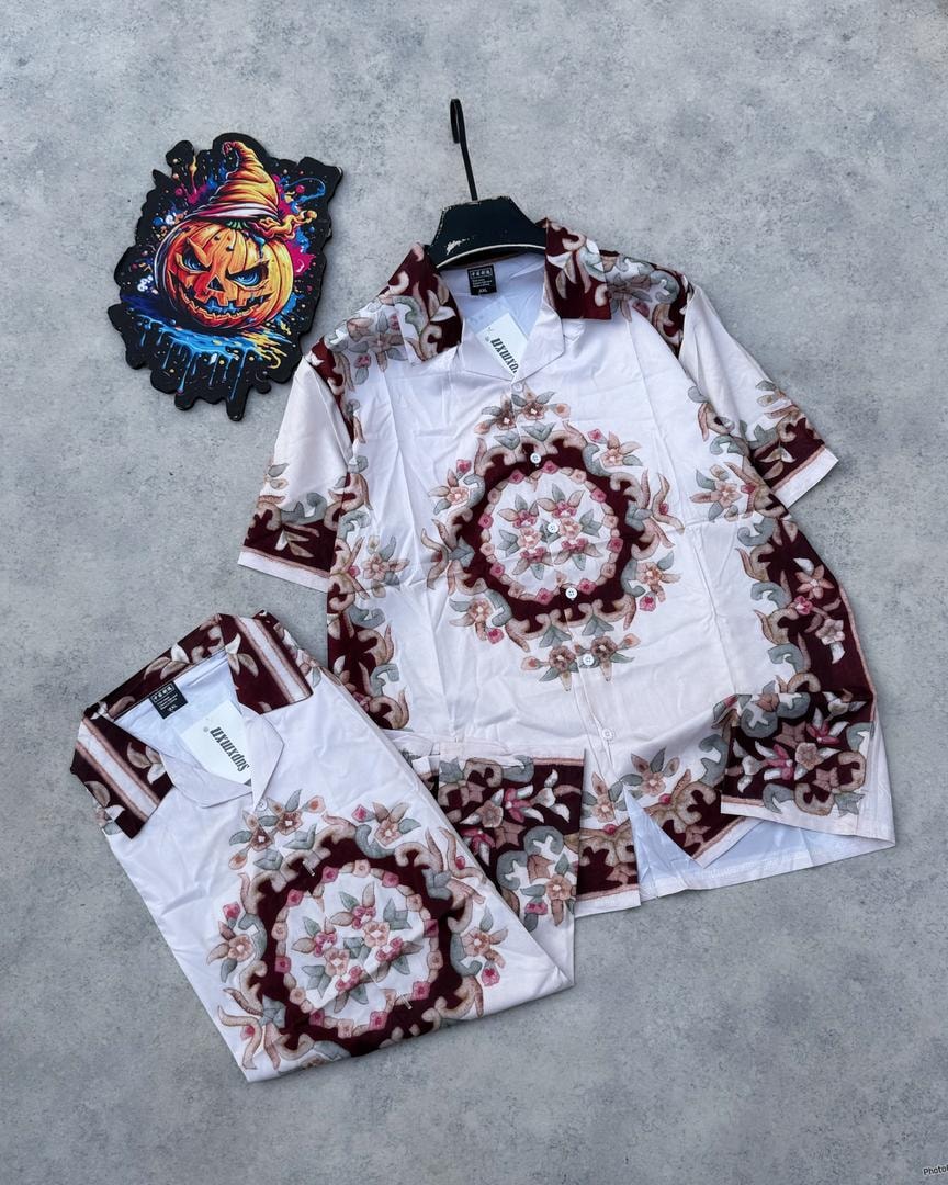 White short sleeve shirt with maroon circular floral mandala pattern.
